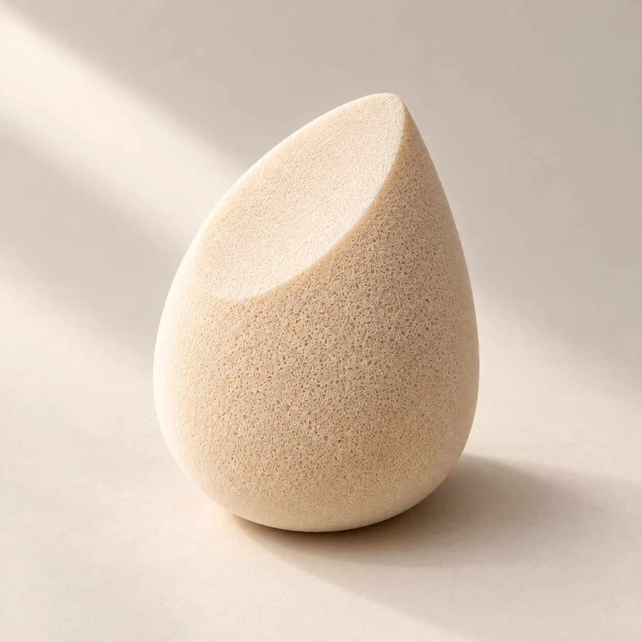 Form 02 — The Wedge — One slanted-cut teardrop sponge, 60 mm high.